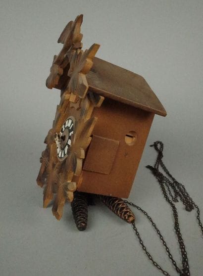 Black Forest-style wooden cuckoo clock with...