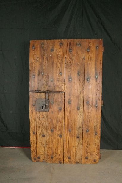 Antique pine barn door with large wrought-iron...