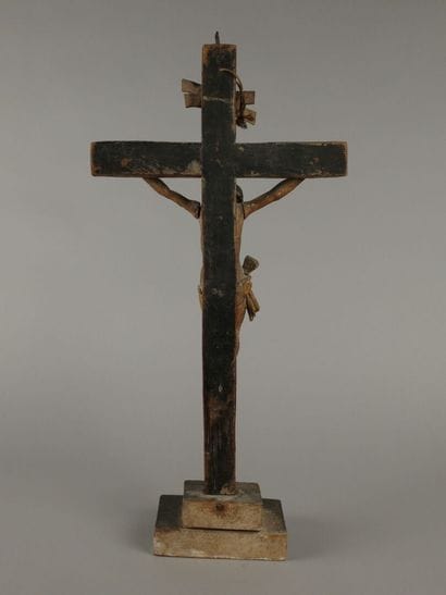 Crucifix: a polychrome carved wooden figure...