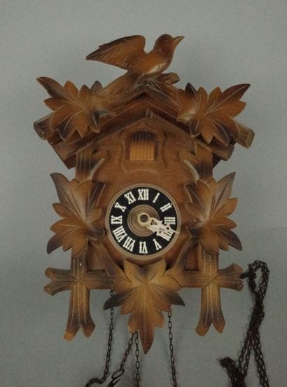 Black Forest-style wooden cuckoo clock with...