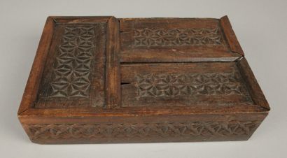 Set includes: - A carved wooden box with...