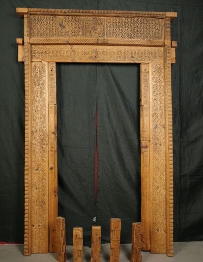 Antique wooden facade richly carved with...