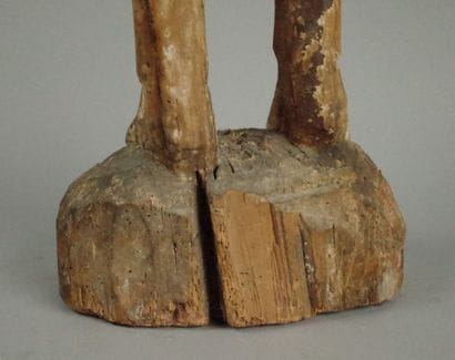 Carved wooden Christ in bonds with traces...