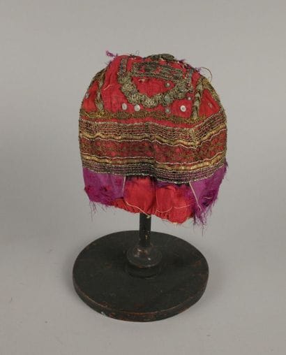 ARVES VALLEY. Red silk headdress lining with...