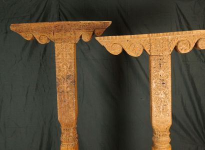 Two carved pine columns with consoles decorated...