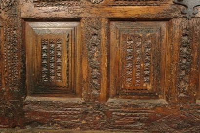 Large natural wood chest with a paneled front...