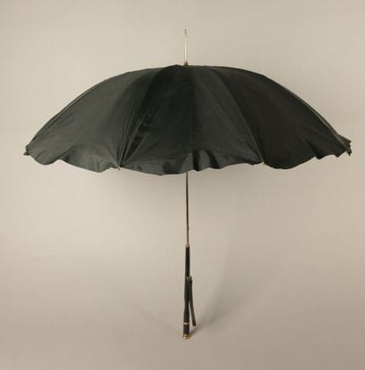 Black nylon parasol, with a black leather-covered...