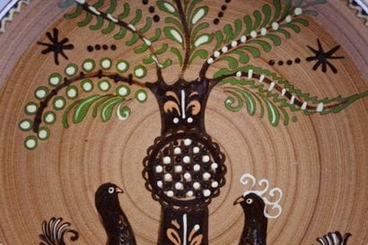 Glazed ceramic plate with a polychrome design...