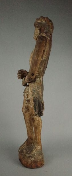 Carved wooden Christ in bonds with traces...