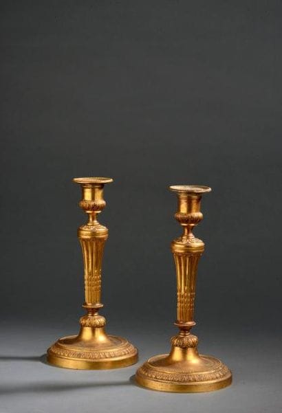 Paire de flambeaux en bronze ciselé et doré...