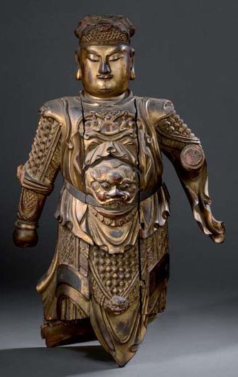 Statue de gardien en bois laqué rouge et...