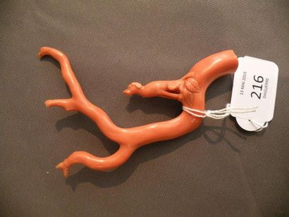 Branche de corail sculpté d'un petit chien...