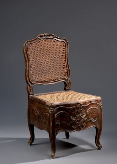 Chaise d'aisance cannée, estampillée P. Forget...
