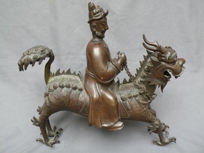 Immortel chevauchant un Qilin, bronze Travail...
