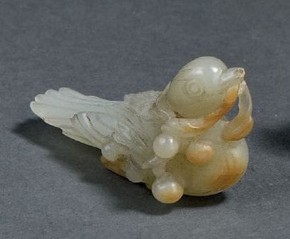 Groupe en jade blanc et rouille sculpté
Chine,...