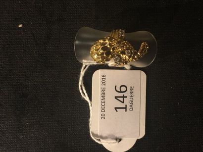 Bague noeud en or jaune ajouré d'écailles...
