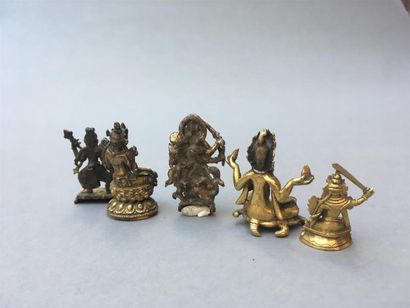 CINQ STATUETTES en bronze doré
Tibet, XVIIIe...