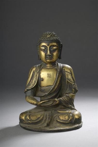 STATUETTE DE BOUDDHA en bronze doré
Chine,...