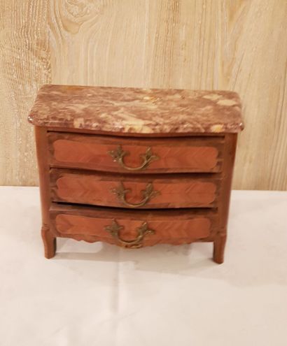 Small miniature chest of drawers opening...