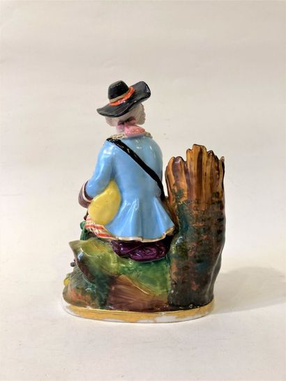 Pair of polychrome porcelain groups featuring...