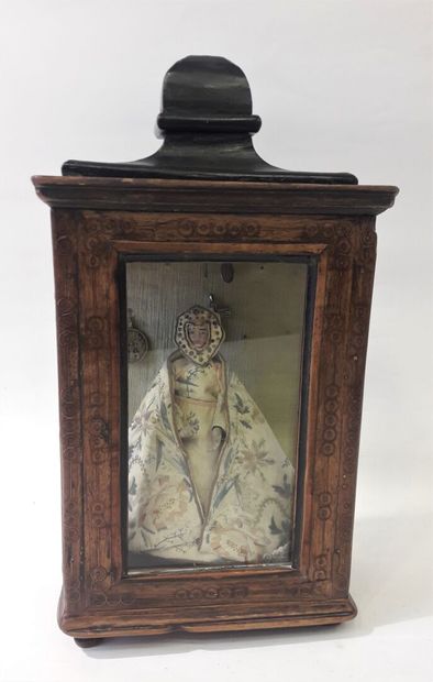 Small showcase in natural wood opening to...