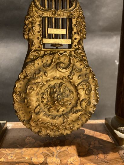 Portico clock in veneer with marquetry decoration
Napoleon...