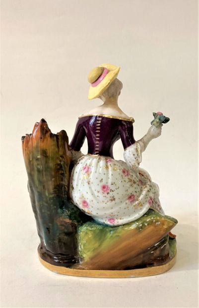 Pair of polychrome porcelain groups featuring...