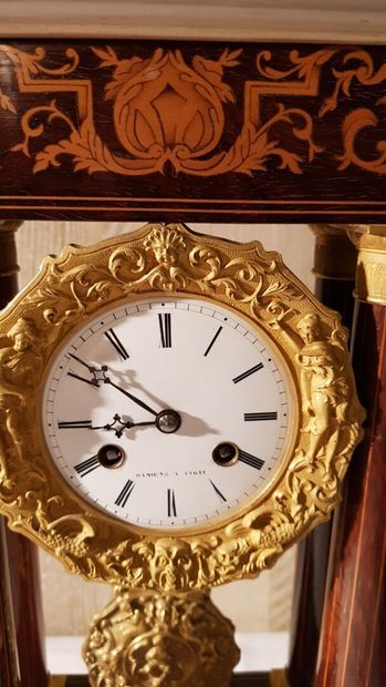 Portico clock in marquetry of light wood...