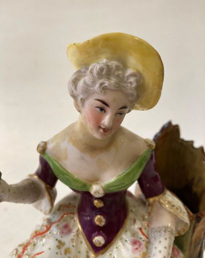 Pair of polychrome porcelain groups featuring...