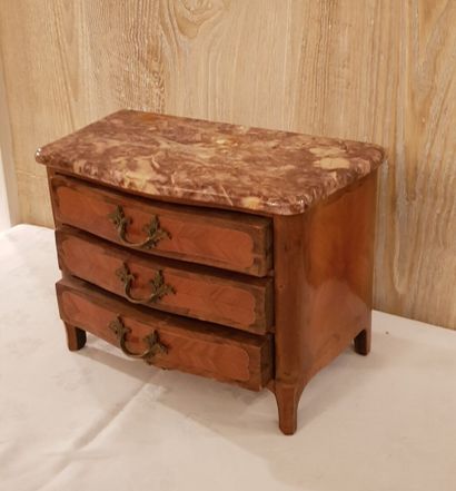 Small miniature chest of drawers opening...