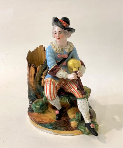 Pair of polychrome porcelain groups featuring...