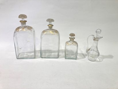 Lot of glass bottles decorated in gold