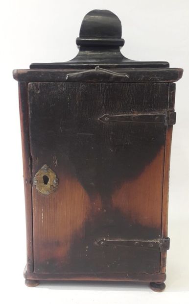 Small showcase in natural wood opening to...