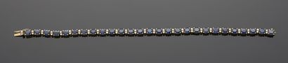 Bracelet ligne en or jaune 18K 750‰, serti...