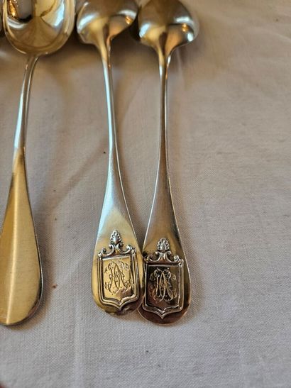 Nine silver dessert spoons spatula decorated...