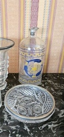 Lot including:
Set of four vases and one...