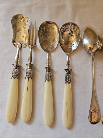 Nine silver dessert spoons spatula decorated...