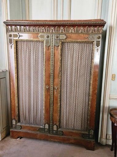 Regence style low cabinet opening with two...