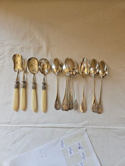 Nine silver dessert spoons spatula decorated...