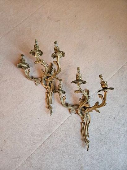 Pair of ormolu three-light sconces in rocaille...