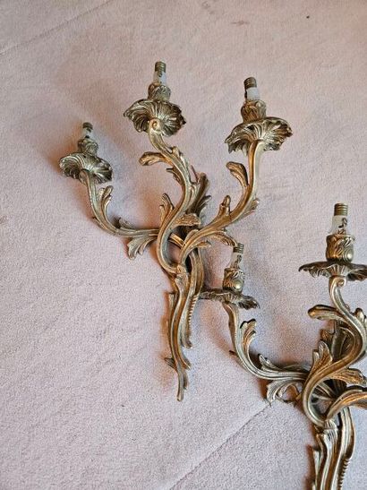 Pair of ormolu three-light sconces in rocaille...