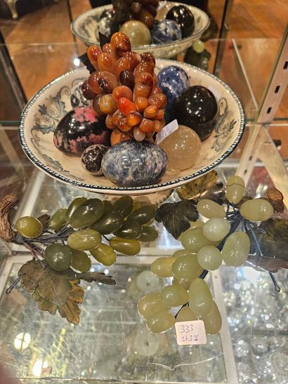 Set of eggs and bunches of grapes in hard...