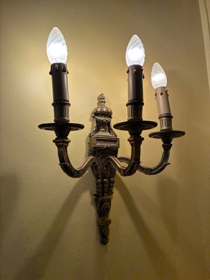 Pair of three-light ormolu sconces topped...
