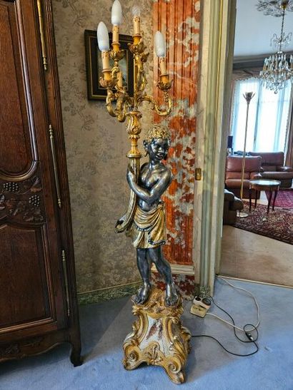 Gilded patinated wood group presenting a...