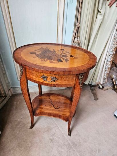 Oval-shaped coffee table in wood veneer and...