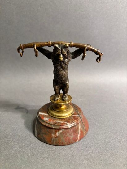 Bronze watch-holder featuring a bear on a...
