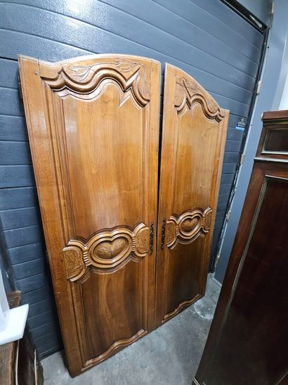 Pair of molded and carved fruitwood doors...