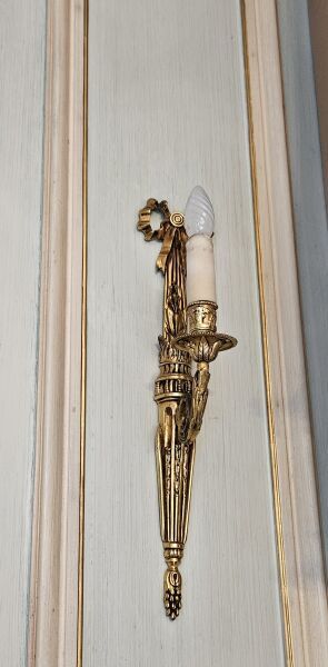 Pair of single-light ormolu sconces 
Fluted...