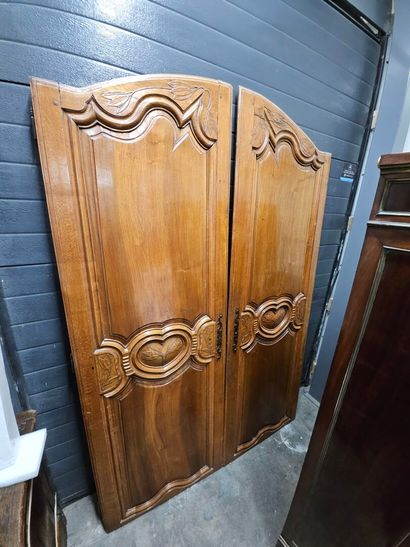 Pair of molded and carved fruitwood doors...