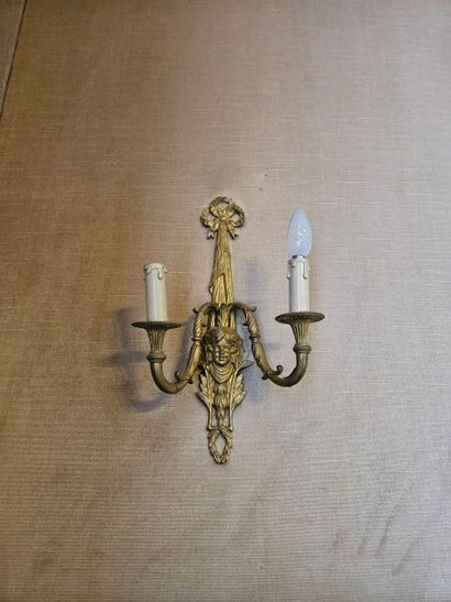 Pair of two-light ormolu sconces decorated...